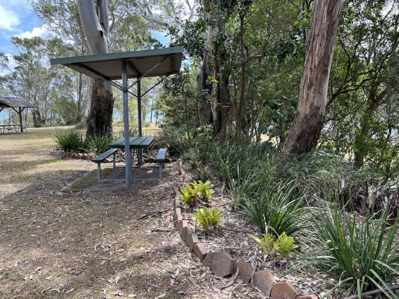 Sunset-Park-picnic-table-with-cover-near-garden-beds